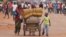FILE - A family with its belongings on a makeshift cart is seen in Bangui, Central African Republic, Sept. 30, 2015. Many residents are fleeing sectarian clashes between rivaling Christian and Muslim militias.