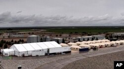 This undated photo provided by HHS’ Administration for Children and Families shows the shelter used to house unaccompanied foreign children in Tornillo, Texas. 