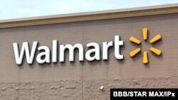 FILE - Shareholders will vote on whether Walmart should report on the fairness of its pay scale.