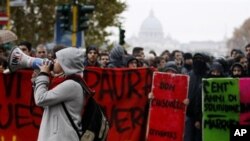 Italian students protest against the government-proposed education reforms, which are being voted in the Italian parliament, in Rome, 30 Nov 2010