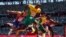 Hansle Parchment, of Jamaica, wins the men's 110-meter hurdles final past Grant Holloway, of the United States, at the 2020 Summer Olympics, Aug. 5, 2021, in Tokyo, Japan. 