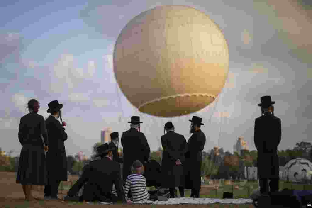 Ultra-Orthodox Jews enjoy their day in a park in Tel Aviv, Israel.