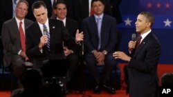 President Barack Obama (R) and Republican presidential candidate Mitt Romney spar in their second debate in Hempstead, NY, October 16, 2012.