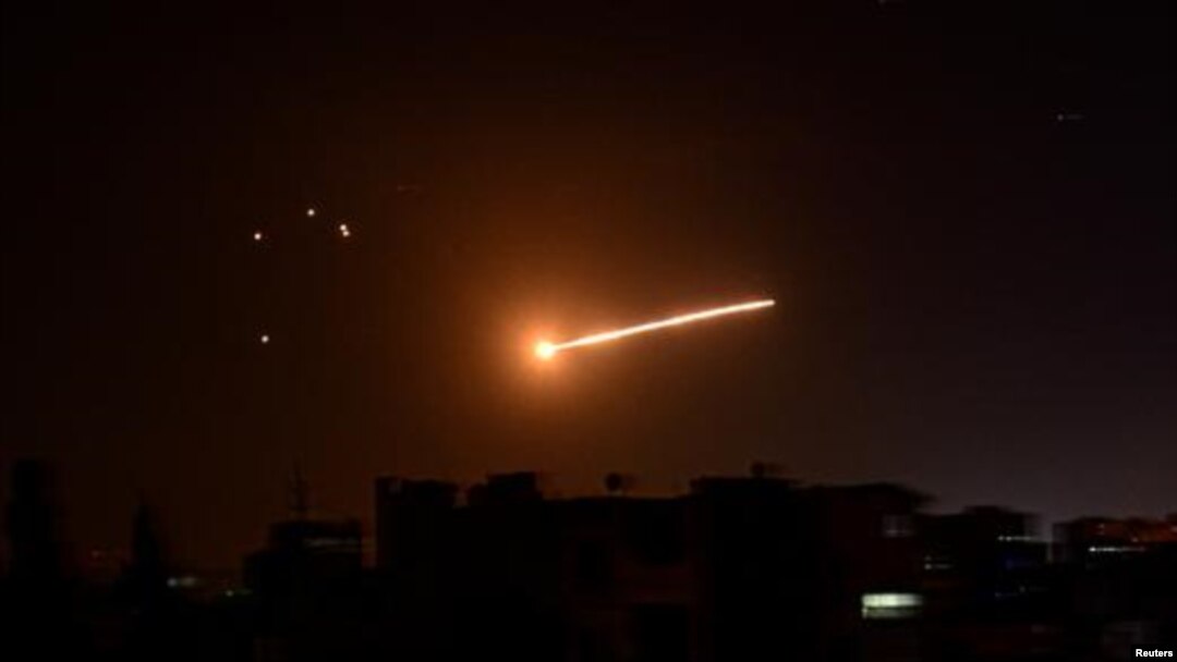 Light in the sky is seen in Damascus, Syria, in this handout released by SANA on February 24, 2020. SANA/Handout via REUTERS SANA February 23, 2020 10:55pm EST