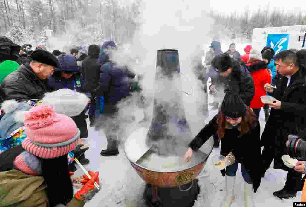 Visitors enjoy a hotpot in subzero temperatures at the opening ceremony of a &quot;Pole of Cold&quot; festival in Genhe, Inner Mongolia, China, Dec. 25, 2018.