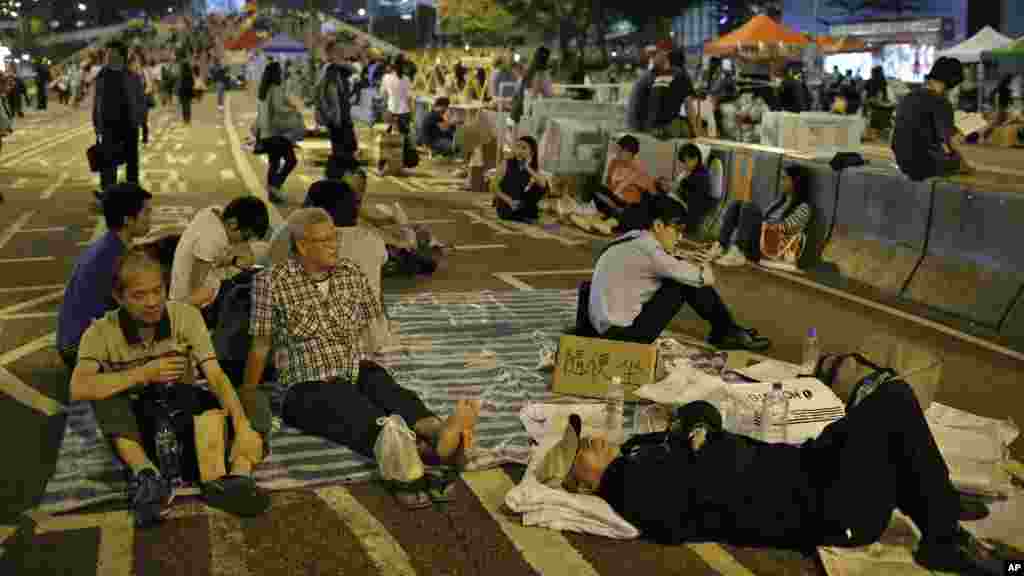 Protesters take a rest during a rally in the occupied areas at Central district in Hong Kong, Oct. 9, 2014. 