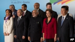 FILE - Leaders of the BRICS and South American nations pose for a group photo at the BRICS summit at Itamaraty palace in Brasilia, Brazil, July 16, 2014. 