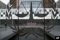 A person leaves the International Criminal Court in The Hague, Netherlands, Jan. 16, 2019.