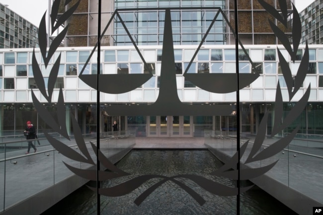 FILE - A person leaves the International Criminal Court in The Hague, Netherlands, Jan. 16, 2019.