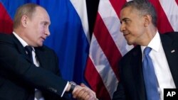 Presidents Barack Obama and Vladimir Putin, pictured here during a 2012 summit meeting, have been encouraging intelligence sharing since the Boston Maraton bombing. 