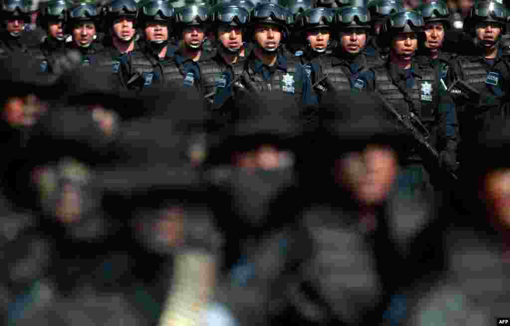 June 2: Members of the federal police participate in a ceremony to mark Federal Police Day in Mexico City. (Reuters)