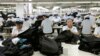 FILE - North Korean workers assemble Western-style suits on Sept. 21, 2012, at the South Korean-run ShinWon Corp. garment factory inside the Kaesong industrial complex in Kaesong, North Korea.