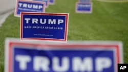 Republican presidential candidate Donald Trump signs are posted outside of the Allen County War Memorial Coliseum during a campaign stop, May 1, 2016, in Fort Wayne, Ind.