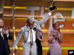 Chance The Rapper accepts the Grammy for best new artist. (Photo by Matt Sayles/Invision/AP)