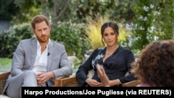 Britain's Prince Harry and Meghan, Duchess of Sussex, are interviewed by Oprah Winfrey in this undated handout photo. 