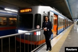Serpil Cigdem, 44, an engine driver, poses for a photograph at Yenikapi station in Istanbul, Turkey, Feb. 24, 2017.