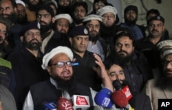 FILE - Pakistani cleric Hafiz Saeed addresses his supporters in Lahore, Pakistan, Jan. 30, 2017.