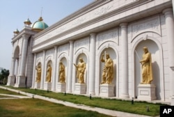 FILE - Statues of Roman-like Gods are seen in front of Kings Romans Casino. (Daniel Schearf/VOA)