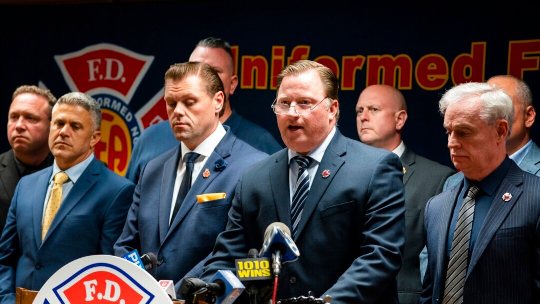 Andrew Ansbro, FDNY Uniformed Firefighters Association president, speaks during a news conference to address a new COVID-19 vaccine mandate, Oct. 20, 2021, in New York. The organization says COVID-19 vaccinations should be voluntary.