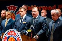 Andrew Ansbro, FDNY Uniformed Firefighters Association president, speaks during a news conference to address a new COVID-19 vaccine mandate, Oct. 20, 2021, in New York. The organization says COVID-19 vaccinations should be voluntary.