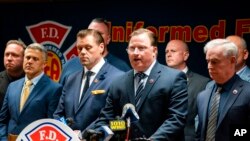 Andrew Ansbro, FDNY Uniformed Firefighters Association president, speaks during a news conference to address a new COVID-19 vaccine mandate, Oct. 20, 2021, in New York. The organization says COVID-19 vaccinations should be voluntary.
