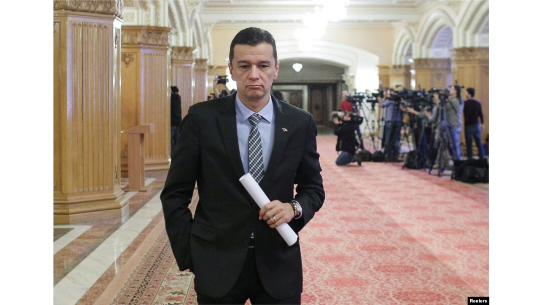FILE - Romania's Prime Minister Sorin Grindeanu leaves a meeting of the Social Democrat Party (PSD) at the parliament in Bucharest, Romania, Feb. 6, 2017.