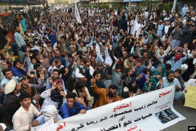 FILE - Pakistani activists of the Pashtun Tahafuz Movement take part in a protest against the arrest of party leader in Karachi on Jan. 23, 2019.