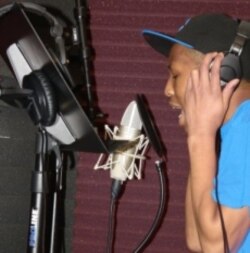 Yung Fresh in the studio, recording his own songs