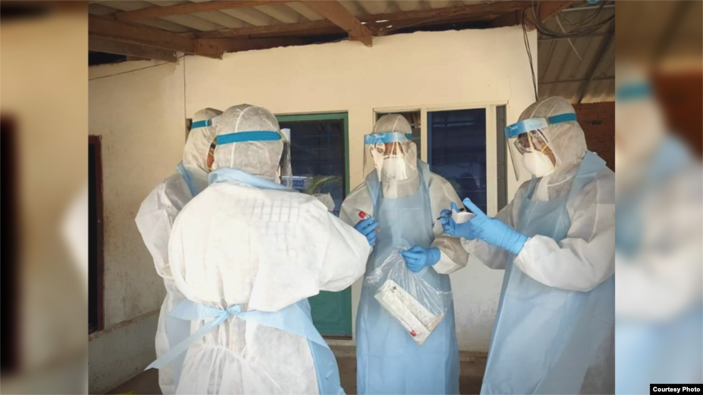 A group of Cambodian medical personnel dressed in protective gear as they performed coronavirus testing in Phnom Penh, Cambodia. (Courtesy of Cambodia&#39;s Communicable Disease Control Department)