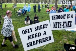 FILE - People gather for the Reason Rally on the National Mall March 24, 2012 in Washington, DC. Atheists and those who oppose religion in government gathered for a rally where they celebrated not having religious affiliations.