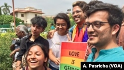 FILE - The LGBT community celebrates outside the Supreme Court in New Delhi, India, after it scrapped a law that criminalizes gay sex, Sept. 6, 2018.