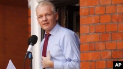 WikiLeaks founder Julian Assange makes a statement to the media and supporters at a window of Ecuadorian Embassy in central London, Aug. 19, 2012