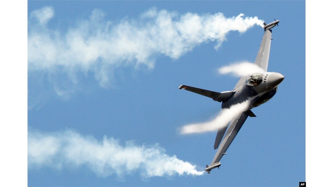 FILE - F16 fighter jet takes part in a flying display during the 49th Paris Air Show.