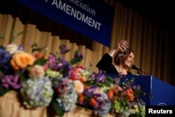 FILE - White House Correspondents' Association President Margret Margaret Talev speaks at the White House Correspondents' Association dinner in Washington, April 28, 2018.