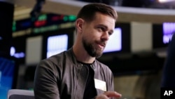 FILE - Twitter's Jack Dorsey is interviewed on the floor of the New York Stock Exchange, Nov. 19, 2015. The chief executive apologized Thursday, Nov. 17, 2016, after the service let through an ad promoting a white supremacist group.