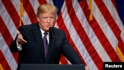 U.S. President Donald Trump delivers remarks at the Ronald Reagan Building and International Trade Center in Washington, Dec. 18, 2017. 