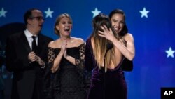 Gal Gadot and Patty Jenkins embrace as "Wonder Woman" wins the award for best action movie at the 23rd annual Critics' Choice Awards at the Barker Hangar on Jan. 11, 2018, in Santa Monica, California.