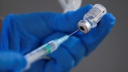 A nurse fills a syringe with a second dose of the Pfizer-BioNTech COVID-19 vaccine, in Madrid, on February 4, 2021.