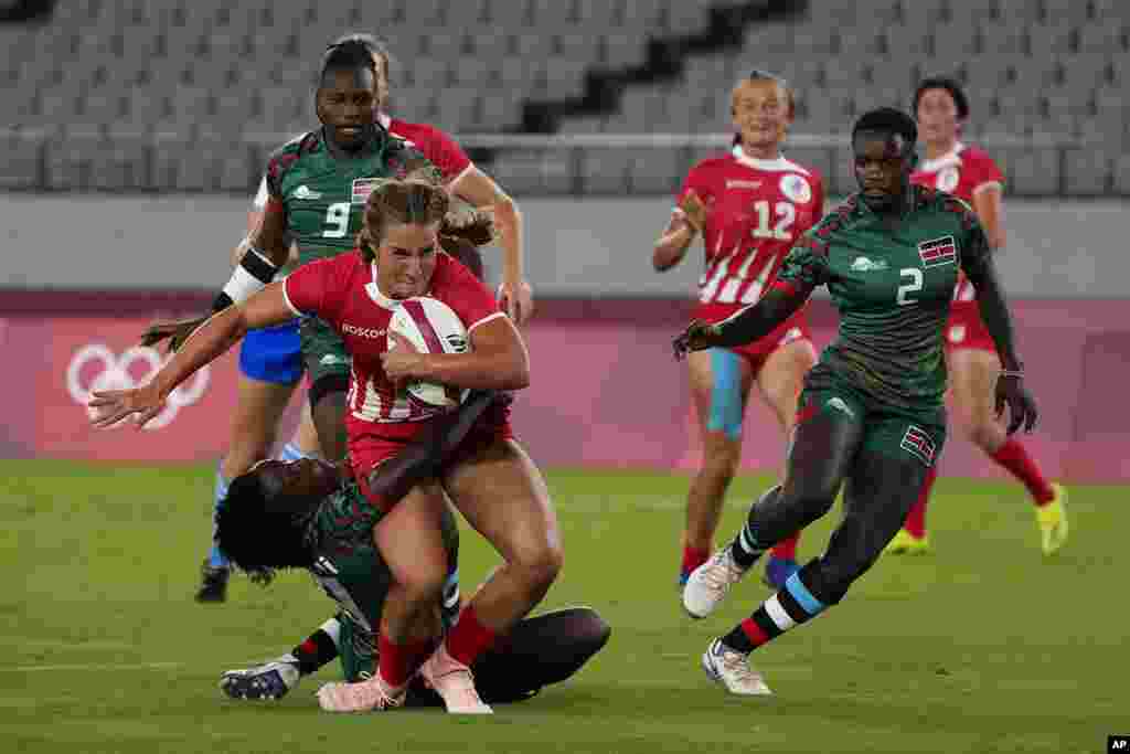 Russian Olympic Committee&#39;s Kristina Seredina, left, is tackled by Kenya&#39;s Sinaida Omondi, as she runs on her way to scoring a try in their women&#39;s rugby sevens match at the 2020 Summer Olympics, Thursday, July 29, 2021 in Tokyo, Japan. (AP Photo/Shuji Kajiyama)