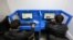 FILE - In this Feb. 10, 2016 photo, Afghans access social media websites at a private internet cafe in Kabul, Afghanistan.