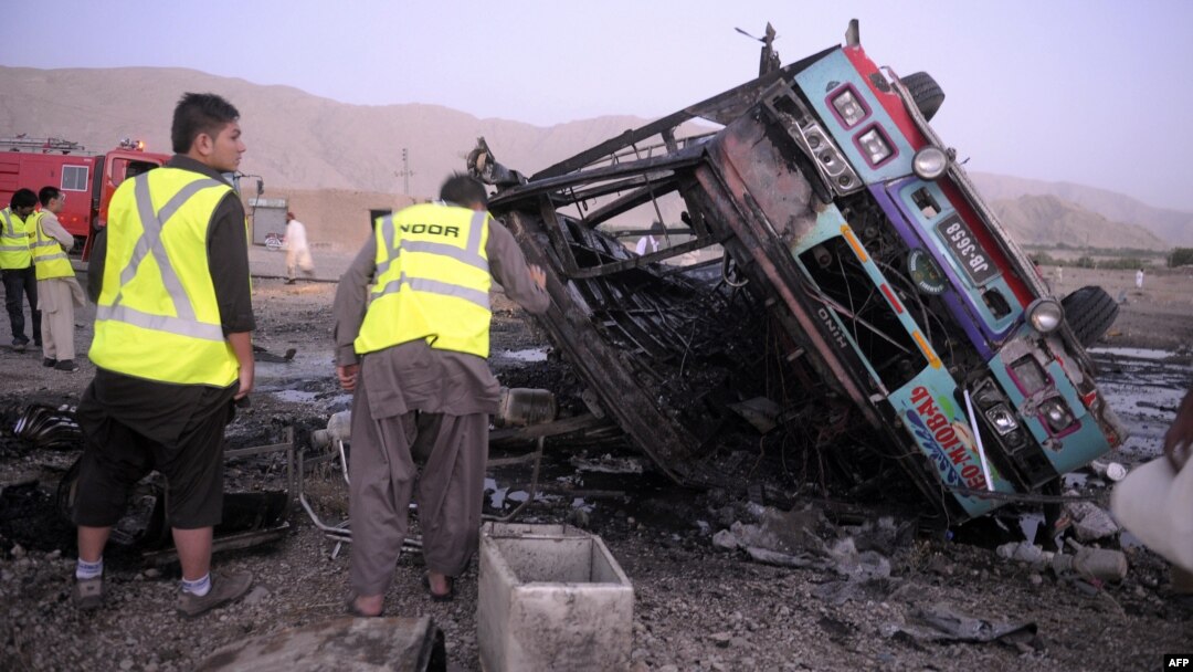 Pakistani volunteers search for blast victims in the wreckage of a destroyed passenger bus following a bomb explosion in Mastung district, about 25 kilometres south of Quetta, the capital of insurgency-hit Baluchistan province, September 18, 2012. 