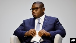 FILE — Sierra Leone's President Julius Maada Bio listens during a session entitled "The Power of Education" that was held during the Global Education Summit in London, July 29, 2021 