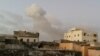 Smoke rises after car bombs explode in Mogadishu, Somalia, Feb. 23, 2018, in this still image taken from social media video.