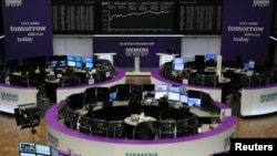 FILE - The German share price index DAX graph is pictured at the stock exchange in Frankfurt, Germany, Sept. 28, 2020. 