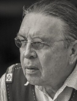 Headshot photo of Cheyenne/Arapaho artist Harvey Pratt, who submitted the winning design for a new Native American Veterans' Memorial in Washington, D.C. Photo by and courtesy of Neil Chapman.