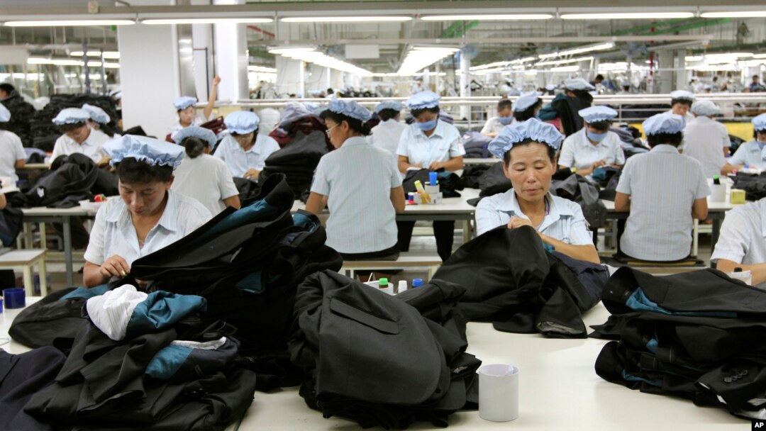 FILE - North Korean workers assemble Western-style suits on Sept. 21, 2012, at the South Korean-run ShinWon Corp. garment factory inside the Kaesong industrial complex in Kaesong, North Korea.