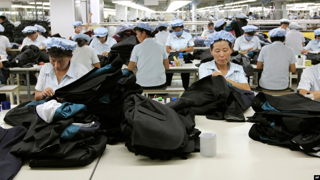 FILE - North Korean workers assemble Western-style suits at the South Korean-run ShinWon Corp. garment factory inside the Kaesong Industrial Complex in Kaesong, North Korea.