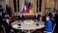 FILE - From left, Ukrainian President Volodymyr Zelenskiy, French President Emmanuel Macron, Russian President Vladimir Putin and German Chancellor Angela Merkel attend a working session in Paris, Dec. 9, 2019.