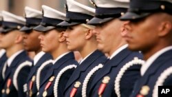 FILE - Members of a U.S. Coast Guard honor detail stand at attention at the Pentagon, Sept. 9, 2008.