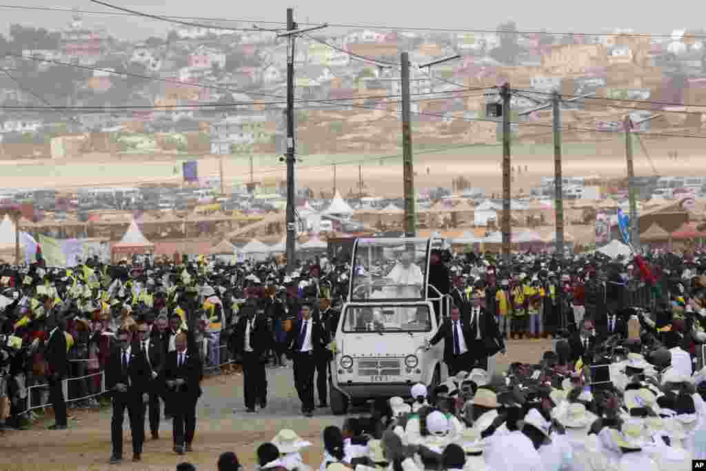 Pope Francis arrives with the popemobile to celebrate a mass in Antananarivo, Madagascar.